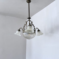 Brass chandelier with a cut glass frosted diffuser shade and three frosted frilled glass shades