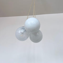 Three Small White Mottled Globe Shades