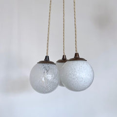 Three Small White Mottled Globe Shades