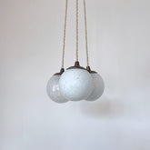 Three Small White Mottled Globe Shades
