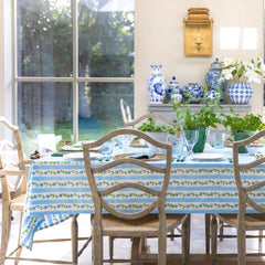 tablecloth hand block stripes, flowers and leaves in soft blues, green and white.