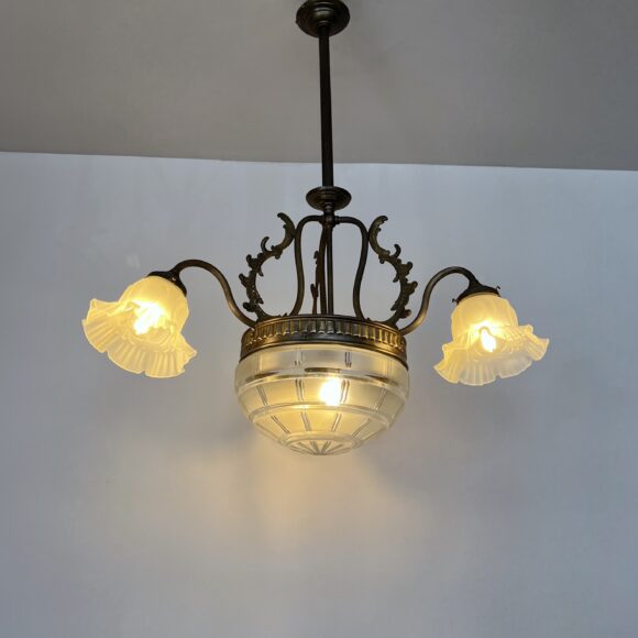 Brass chandelier with a cut glass frosted diffuser shade and three frosted frilled glass shades