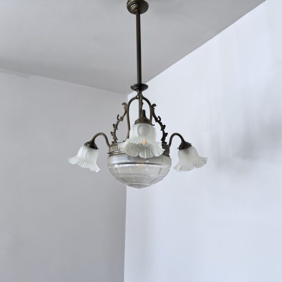 Brass chandelier with a cut glass frosted diffuser shade and three frosted frilled glass shades