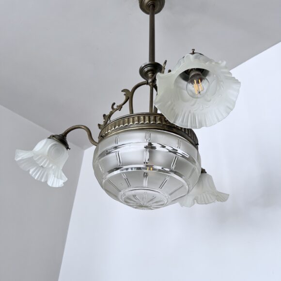 Brass chandelier with a cut glass frosted diffuser shade and three frosted frilled glass shades