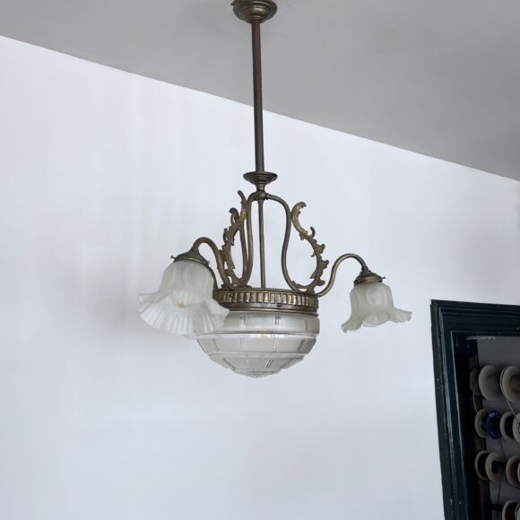 Brass chandelier with a cut glass frosted diffuser shade and three frosted frilled glass shades