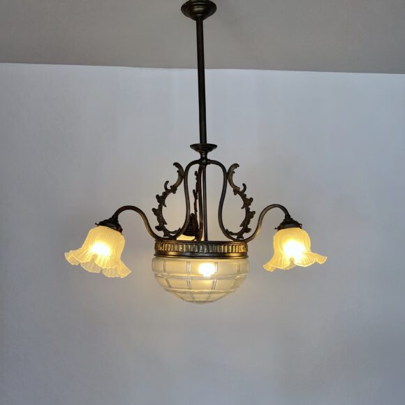 Brass chandelier with a cut glass frosted diffuser shade and three frosted frilled glass shades