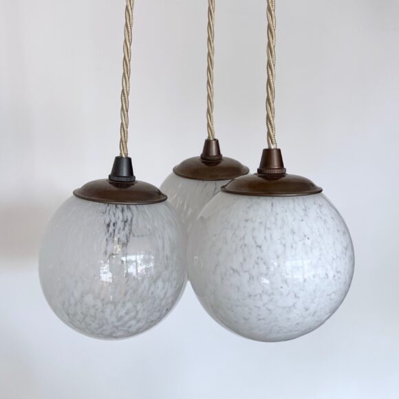 Three Small White Mottled Globe Shades