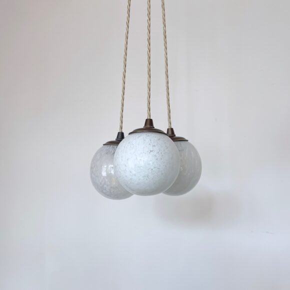 Three Small White Mottled Globe Shades